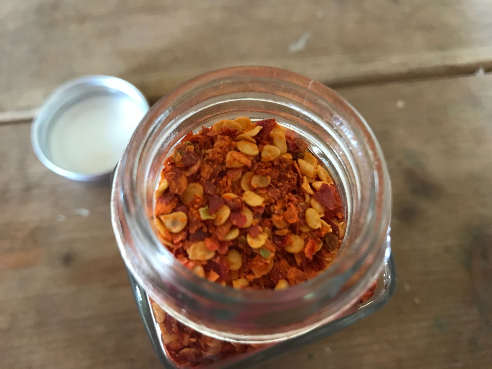Dried and crushed Red Chili peppers to add a kick! No other ingredients.